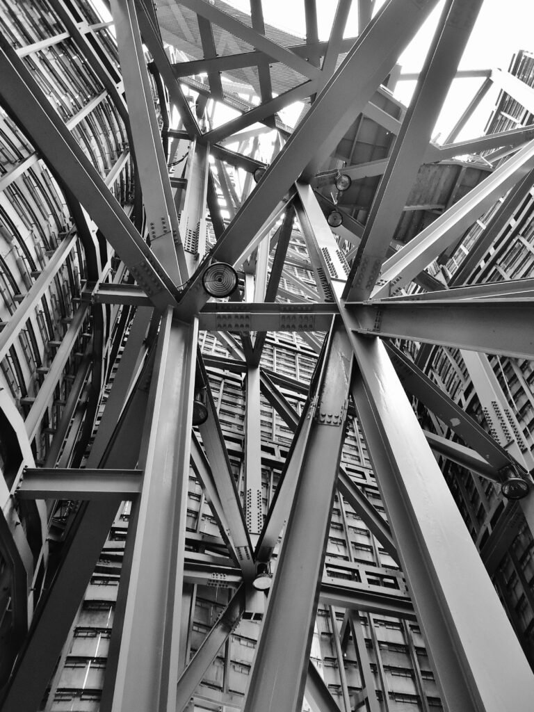 architecture-iron-steel-building-53176-53176 A detailed view of a complex steel framework showcasing modern industrial architecture.